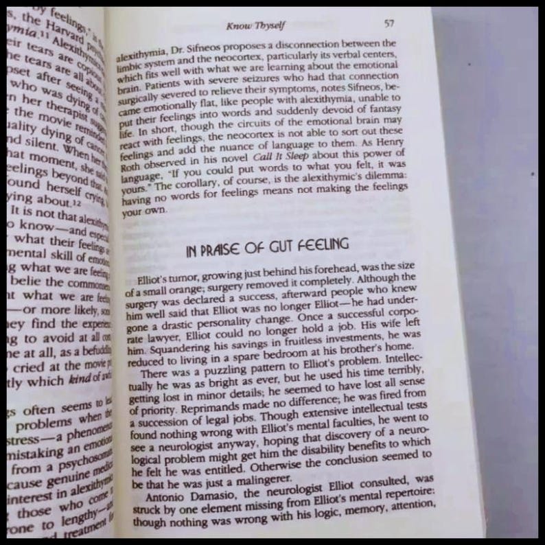 May include: Open book page with text about alexithymia and the phrase "In Praise of Gut Feeling." The page numbers are visible. The text is in black font on a white background.
