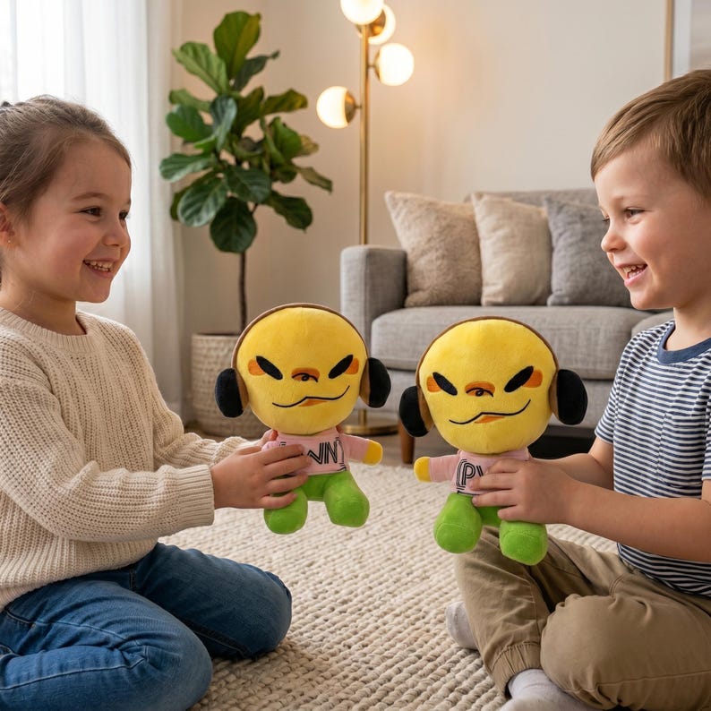 May include: Two plush toys with yellow heads, black headphones, and smiling faces. They wear pink shirts with the letters "VN" and "P" and green trousers. The toys are held by two children.