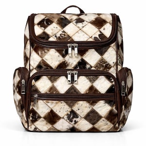 May include: A two-compartment backpack with a patchwork design. The bag features a diamond pattern in shades of brown, cream, and black. It has brown leather trim, zippers, and a top handle. The bag is designed for carrying items.