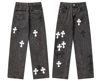 Pantalones vaqueros unisex de mezclilla lavada estilo streetwear con parche cruzado y corte holgado de algodón.