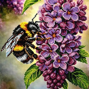 May include: A pixel art style illustration featuring a bumblebee with yellow, black, and white markings perched on a cluster of purple lilac flowers with green leaves. The image is composed of small square blocks creating a mosaic effect.