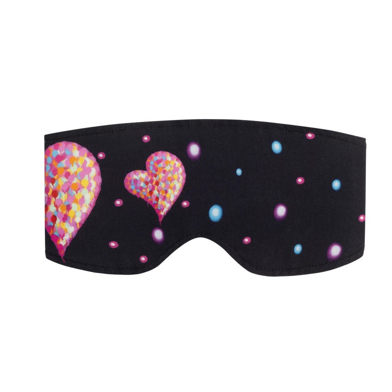 May include: A black sleep mask featuring two heart shapes and small dots in various colors. The hearts are filled with colorful, textured patterns. The dots are pink, purple, and blue. The mask is designed to block out light.