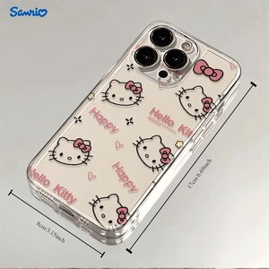 May include: Clear phone case featuring a Hello Kitty design with pink bows and the words "Happy" and "Hello Kitty." The case measures 6.69 inches (17cm) in height and 3.15 inches (8cm) in width. The Sanrio logo is visible in the top left corner.