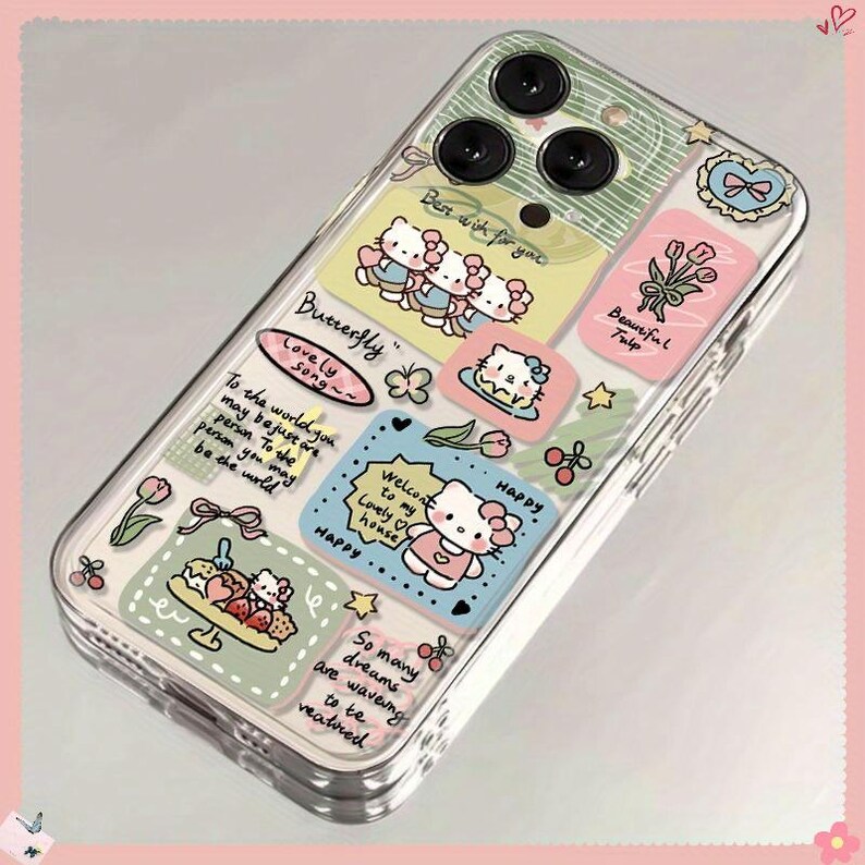 May include: Clear phone case with colorful cartoon graphics. Features Hello Kitty characters, flowers, and text like "Butterfly" and "Happy." The case has a clear border and covers the phone's camera.