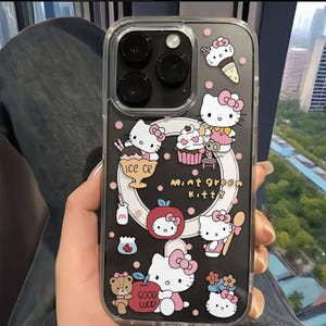 May include: Transparent phone case with a black background, pink polka dots, and Hello Kitty designs. The case features ice cream, cupcakes, and the text "Mint Green Kitty".