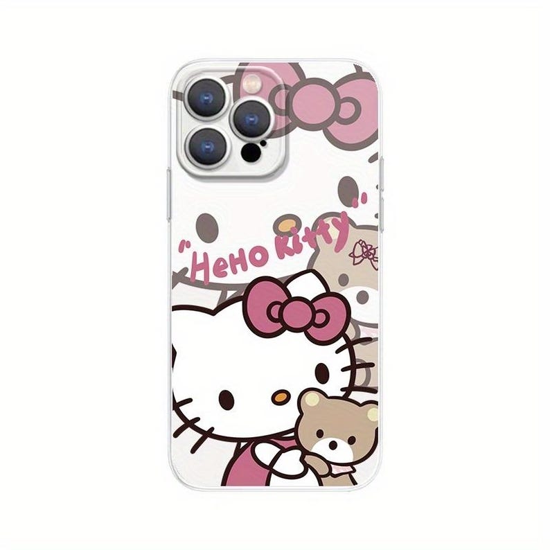 Puede incluir: Funda transparente para tel&eacute;fono con un dise&ntilde;o de Hello Kitty, con un lazo rosa y un peque&ntilde;o oso de peluche. Las palabras "Hello Kitty" est&aacute;n escritas en rosa. La funda tiene un borde transparente y un recorte para la c&aacute;mara.