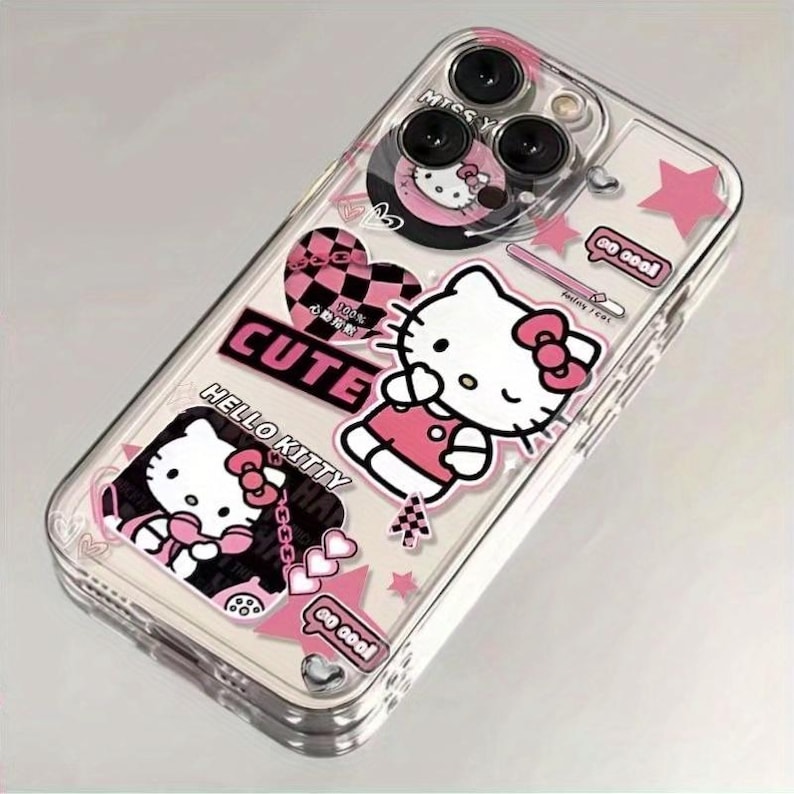 K&ouml;nnte beinhalten: Transparente Handyh&uuml;lle mit Hello Kitty-Designs in Rosa und Wei&szlig;. Die H&uuml;lle enth&auml;lt das Wort "CUTE" und andere dekorative Elemente. Die H&uuml;lle ist f&uuml;r ein Smartphone konzipiert.