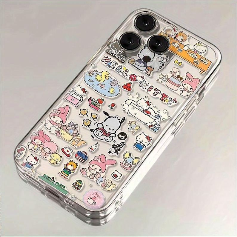 May include: Clear phone case decorated with colorful cartoon character stickers. The stickers feature various characters in playful scenes, including a duck in a pool, a character in a bathtub, and other cute designs. The case has a glossy finish.