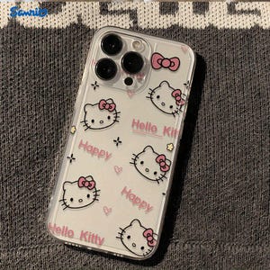 May include: Clear phone case featuring a repeating pattern of Hello Kitty faces with pink bows, the word "Happy", and the text "Hello Kitty". The case has a transparent design with a glossy finish.
