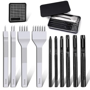 May include: A set of leather working tools, including various punches and a grid cutting mat. The tools are silver and black, with sizes marked as 5mm. The set comes in a black metal case.