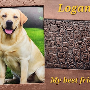 May include: A rectangular picture frame with a brown border featuring embossed paw prints. The frame displays a photo of a yellow Labrador retriever and includes the text Logan and My best friend in yellow lettering on a textured brown panel.