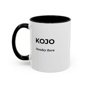 May include: White ceramic mug with a black interior and handle. The mug features the name "KOJO" in black, with "Monday Born" below it. The mug is designed for hot beverages.