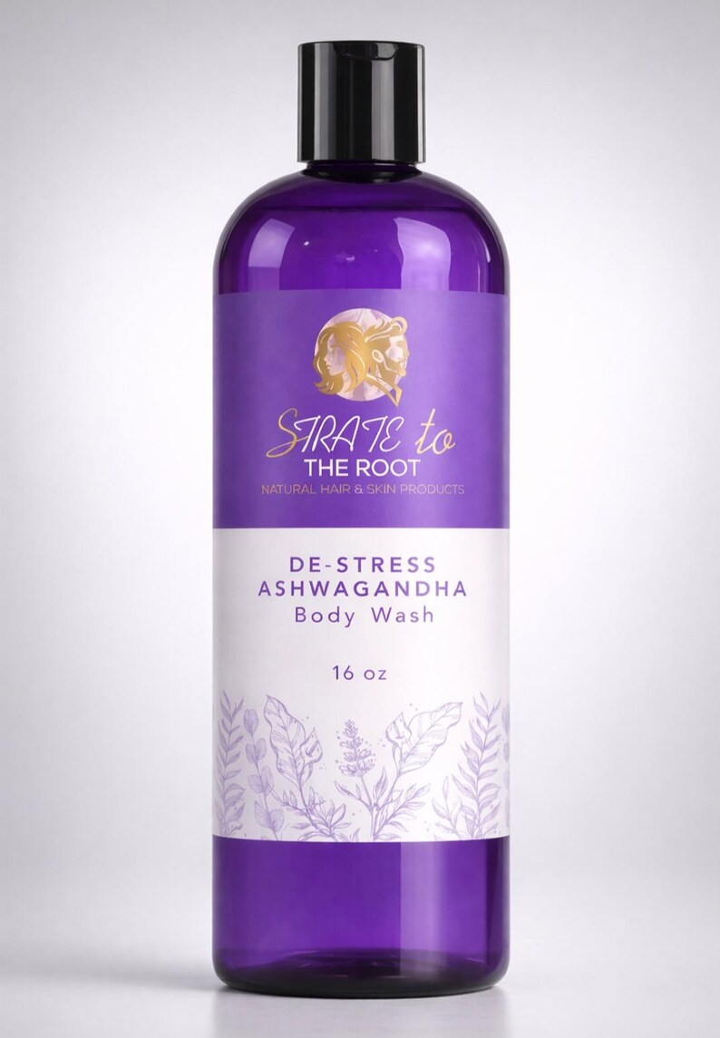 May include: A purple body wash bottle with a black cap. The label reads "STRATE to THE ROOT" and "DE-STRESS ASHWAGANDHA Body Wash." It contains 16 oz of product. The bottle has a clean, minimalist design.