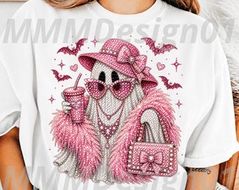 May include: A white t-shirt featuring a graphic of a ghost wearing a pink hat, pink sunglasses, and a pink feather boa. The ghost holds a pink drink and a pink handbag, surrounded by pink bats, hearts, and stars. The text MMMDesign01 is visible.