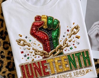 May include: White t-shirt featuring a raised fist in red, black, green, and gold, with a gold chain and the word "JUNETEENTH" in red, yellow, and green. The text "FREE ISH SINCE 1865" is also displayed.