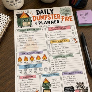 May include: A Daily Dumpster Fire Planner sheet featuring sections for tasks, schedules, and mood tracking. The design includes illustrations of a burning dumpster, a raccoon, and fire icons, with printed text such as Today's Dumpster Fire and Wins.