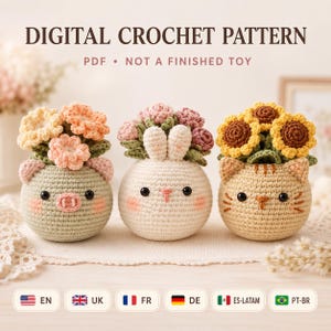 May include: Digital crochet pattern PDF not a finished toy. Three round crocheted animal planters: a sage green pig with peach flowers, a white bunny with pink flowers, and a tan cat with yellow sunflowers. Each has black eyes and stitched details.