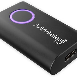 May include: A black rectangular device with rounded edges. The device has a purple illuminated circle on top and the text "/Wireless TWO" in white. A USB-C port is visible on one end.