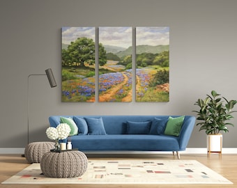 May include: A three-panel canvas print depicting a rural landscape with a dirt road leading through a field of bluebonnet wildflowers. The scene is framed by green trees and rolling hills.