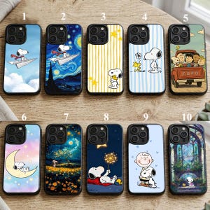 May include: A selection of ten phone cases featuring Snoopy and other Peanuts characters. The cases display diverse designs, including Snoopy on a paper aeroplane, Snoopy in front of a starry night, and Snoopy with Woodstock. The cases have a black border.