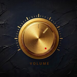 Puede incluir: Un mando de volumen circular dorado con un borde exterior texturizado, una línea indicadora vertical y un pequeño punto rojo. El mando está sobre un fondo negro texturizado con la palabra VOLUME impresa en dorado debajo del dial.