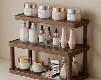 Estante organizador minimalista de nogal para tocador, ideal para exhibir productos de cuidado de la piel y perfumes.