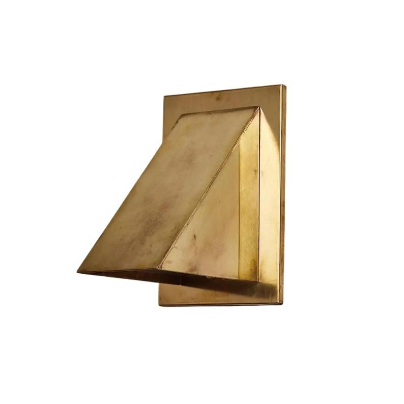 May include: A wall-mounted brass light fixture featuring a rectangular backplate and a protruding, angled triangular shade. The metal surface displays a weathered, aged patina with subtle variations in tone across its geometric form.