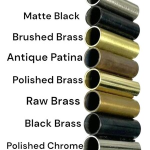 May include: A vertical column of eight cylindrical metal tubes in various finishes, labeled from top to bottom: Brushed Chrome, Matte Black, Brushed Brass, Antique Patina, Polished Brass, Raw Brass, Black Brass, and Polished Chrome.