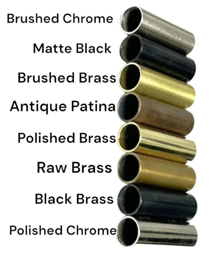 May include: A vertical column of eight cylindrical metal tubes in various finishes, labeled from top to bottom: Brushed Chrome, Matte Black, Brushed Brass, Antique Patina, Polished Brass, Raw Brass, Black Brass, and Polished Chrome.
