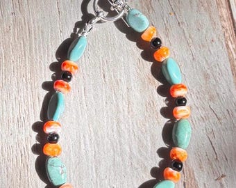 8” Turquoise and orange spiney bracelet