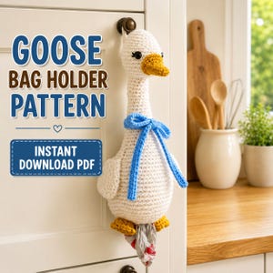 May include: A white crocheted goose bag holder with a yellow beak and feet, featuring a blue ribbon tied around its neck. The text GOOSE BAG HOLDER PATTERN and INSTANT DOWNLOAD PDF is visible. The goose is hanging from a cabinet knob.