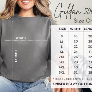 May include: A charcoal gray short-sleeve t-shirt with a size chart overlay labeled Gildan 5000 Size Chart. The chart displays width and length measurements in inches for sizes S through 5XL, with a diagram showing how to measure the garment width and length.