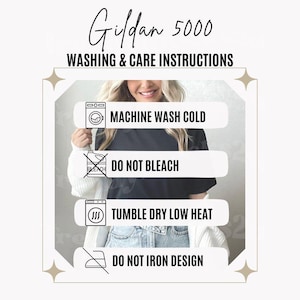 May include: A Gildan 5000 washing and care instructions graphic featuring four icons and text: Machine Wash Cold, Do Not Bleach, Tumble Dry Low Heat, and Do Not Iron Design. The text is presented in black on a white background with star accents.