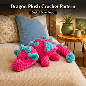 May include: A bright pink and turquoise crochet dragon plush toy with a textured yarn finish and black eyes. The image includes the text Dragon Plush Crochet Pattern and Digital Download.