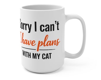 May include: A white ceramic mug featuring black and orange text that reads Sorry I can't I have plans WITH MY CAT. The mug has a cylindrical body with a curved handle on the right side and a smooth, glossy finish throughout the exterior surface.