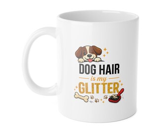 May include: White ceramic mug with a dog-themed design. The mug features a cartoon dog illustration, the text "DOG HAIR is my GLITTER", a bone, paw prints, and a red dog brush. The mug has a white handle.