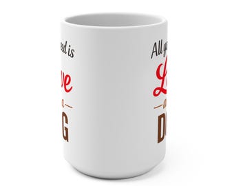 May include: White ceramic mug with the text "All you need is love... and a DOG" in red and brown lettering. The mug is cylindrical and has a simple, clean design, perfect for dog lovers.