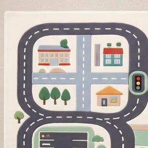 May include: A rectangular play mat featuring a white background with a dark gray road loop, light blue intersecting streets, green trees, a red-roofed house, a blue-roofed building, and a traffic light with red, yellow, and green circular lights.