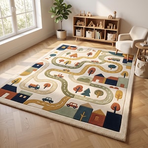 May include: A rectangular area rug featuring a cream-colored background with a winding road pattern in shades of yellow and green. The design includes various small cars, trucks, houses, and trees in muted tones of blue, orange, and green.