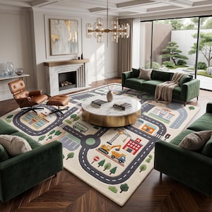May include: A large rectangular area rug featuring a colorful city map design with roads, buildings, construction vehicles, and trees. The rug has a cream-colored background with gray roads, green trees, and various structures in blue, orange, and red.