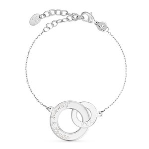 May include: Silver bracelet with two interlocking circles. The larger circle has the inscription "I love you" and the smaller circle has the inscription "xxx".