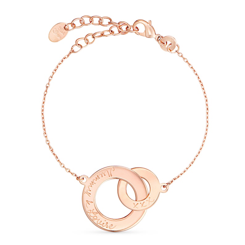 May include: Rose gold interlocking circle bracelet with the inscription "I love you" and "xx" on the circles.
