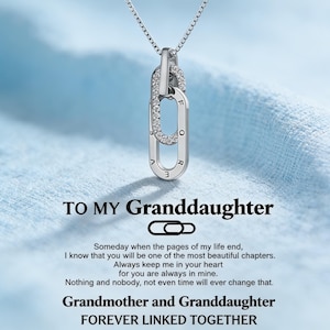 May include: A silver-coloured necklace featuring two interlocking oval links, one encrusted with clear stones and the other engraved with the word FOREVER. Below the pendant, text reads: TO MY GRANDDAUGHTER, followed by a sentimental message and the phrase FOREVER LINKED TOGETHER.