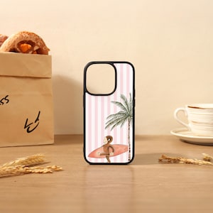 May include: A black smartphone case featuring a light pink and white vertical striped background, a brown monkey character carrying a red surfboard, and a green palm tree illustration on the right side of the case.