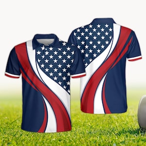 May include: A navy blue polo shirt featuring a design inspired by the American flag. The shirt has a white and red stripe design with white stars on a blue background. The shirt has short sleeves with red and white trim.