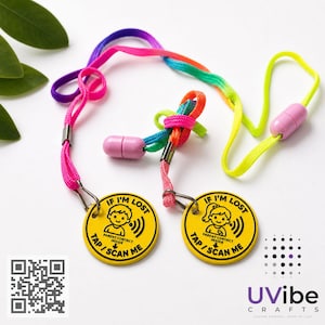 May include: Two yellow circular tags with the text "IF I'M LOST" and "TAP/SCAN ME" are connected to colourful lanyards. The lanyards have a rainbow gradient and pink, yellow, and purple cords. The tags also have a child illustration and the words "PARENT CONTACT INSIDE".