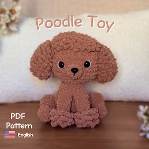 May include: A brown crocheted poodle toy with a textured, curly yarn finish, black plastic eyes, and a small black nose. The text Poodle Toy and PDF Pattern English are visible, along with a small American flag icon on the lower left side.