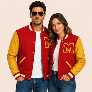 May include: Two varsity jackets featuring a red wool-blend body with yellow sleeves and a yellow letter M patch on the left chest. Each jacket has a snap-button front closure, two side pockets with yellow trim, and ribbed cuffs with white stripes.
