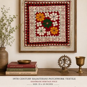 May include: A framed 19th-century Rajasthani patchwork textile. The square textile features a central red field with white, yellow, and green floral designs. The frame is wood, and the textile measures 25 x 20 inches.
