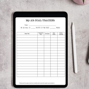 May include: A digital tablet displaying a "My AR Goal Tracker" form. The form includes fields for name, goals, and a table to track book titles, test dates, and quiz scores. A white stylus and a potted plant are next to the tablet.